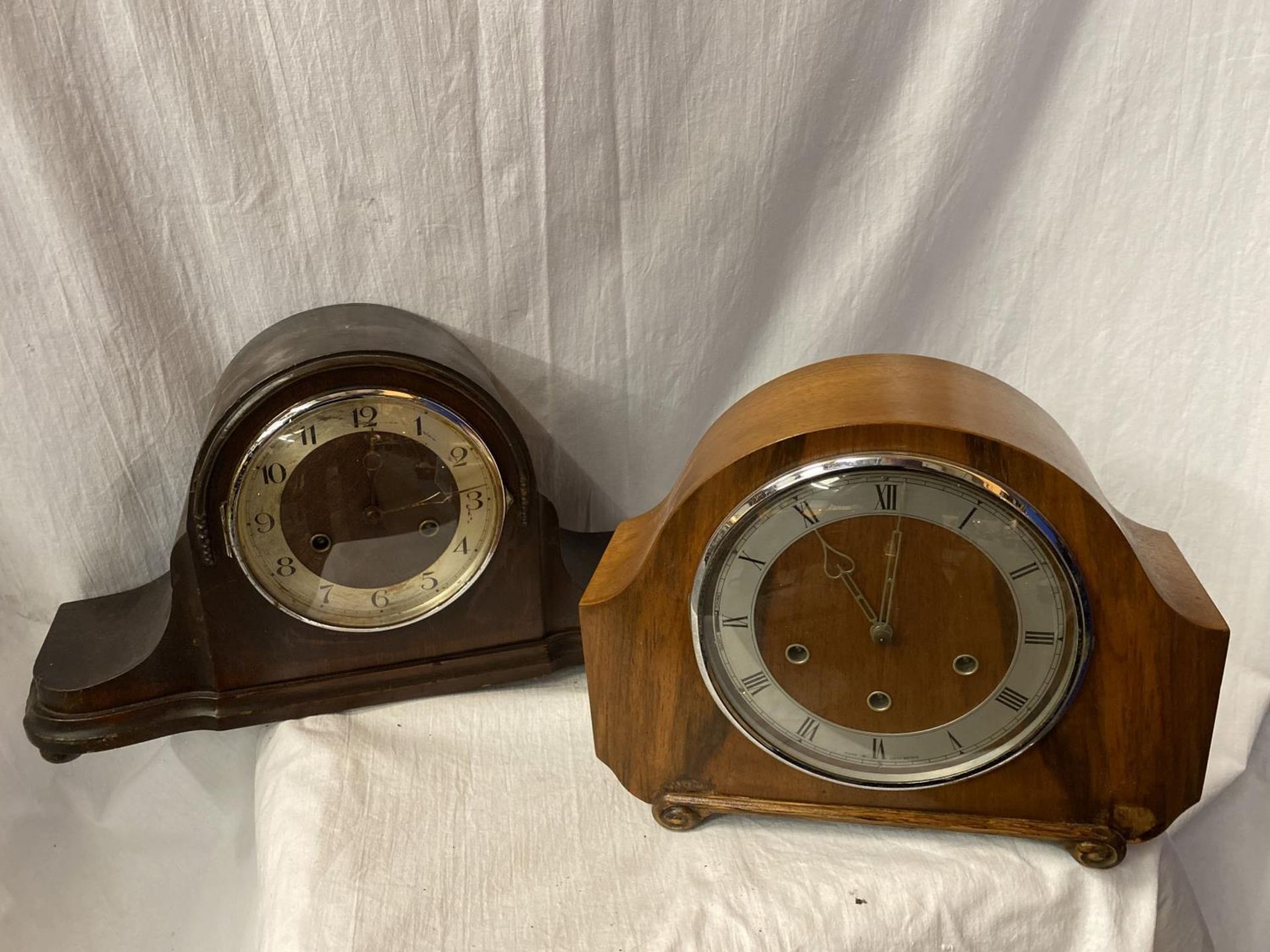 TWO MANTEL CLOCKS, ONE A MAHOGANY NAPOLEON HAT EXAMPLE AND THE OTHER AN ART DECO STYLE