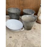 A GROUP OF THREE GALVANISED BUCKETS AND AN ENAMEL PAN