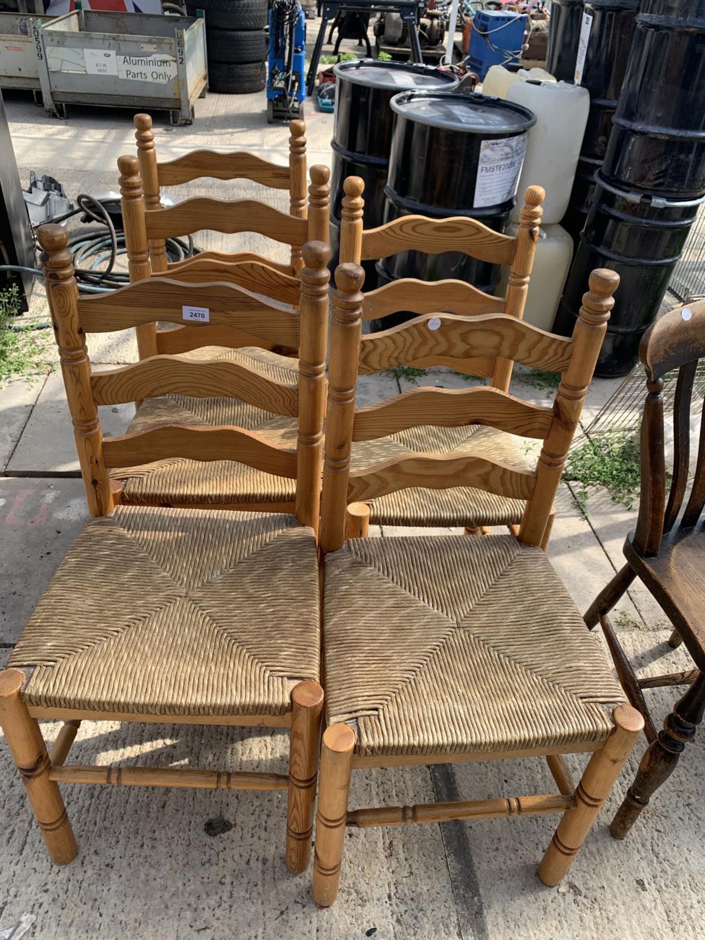 A SET OF FIVE PINE RUSH SEATED LADDERBACK CHAIRS