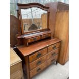 AN EARLY 20TH CENTURY WALNUT DRESSING TABLE WITH BEVEL EDGE MIRROR, TWO SHORT, TWO LONG AND TWO