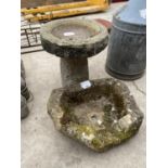 A STONE BIRD BATH AND A FURTHER STONE PLANTER