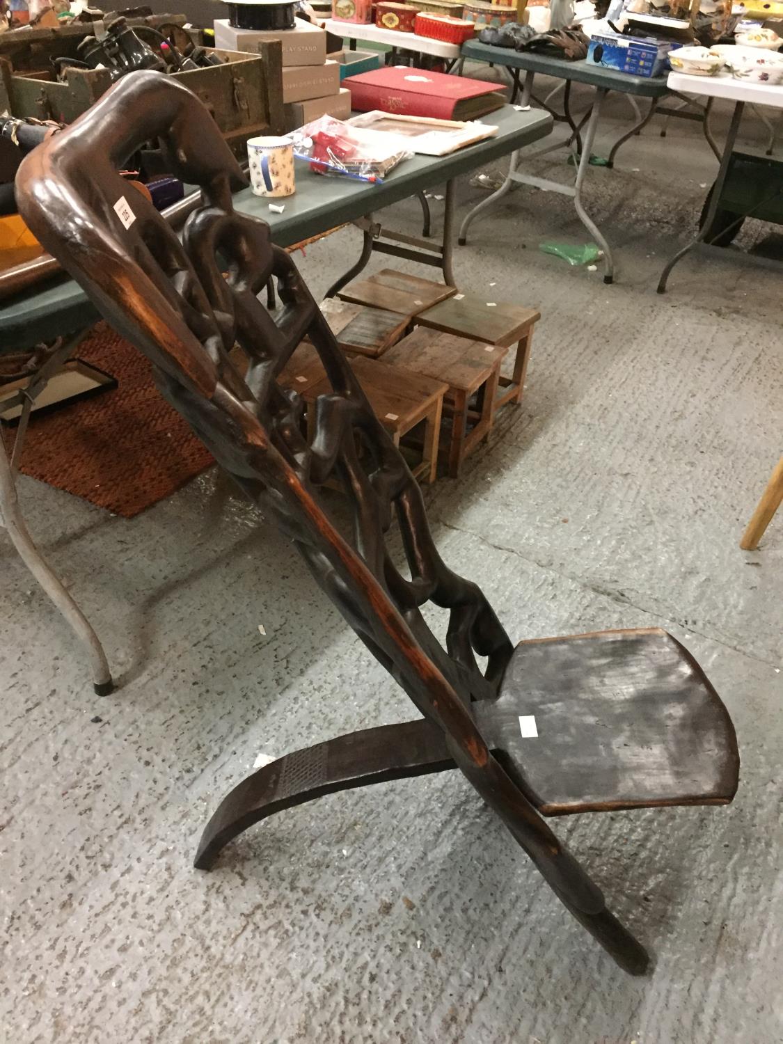 A VINTAGE HARDWOOD CARVED AFRICAN BIRTHING CHAIR