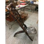 A VINTAGE HARDWOOD CARVED AFRICAN BIRTHING CHAIR