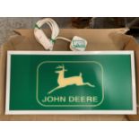 AN ILLUMINATED JOHN DEERE SIGN IN WORKING ORDER