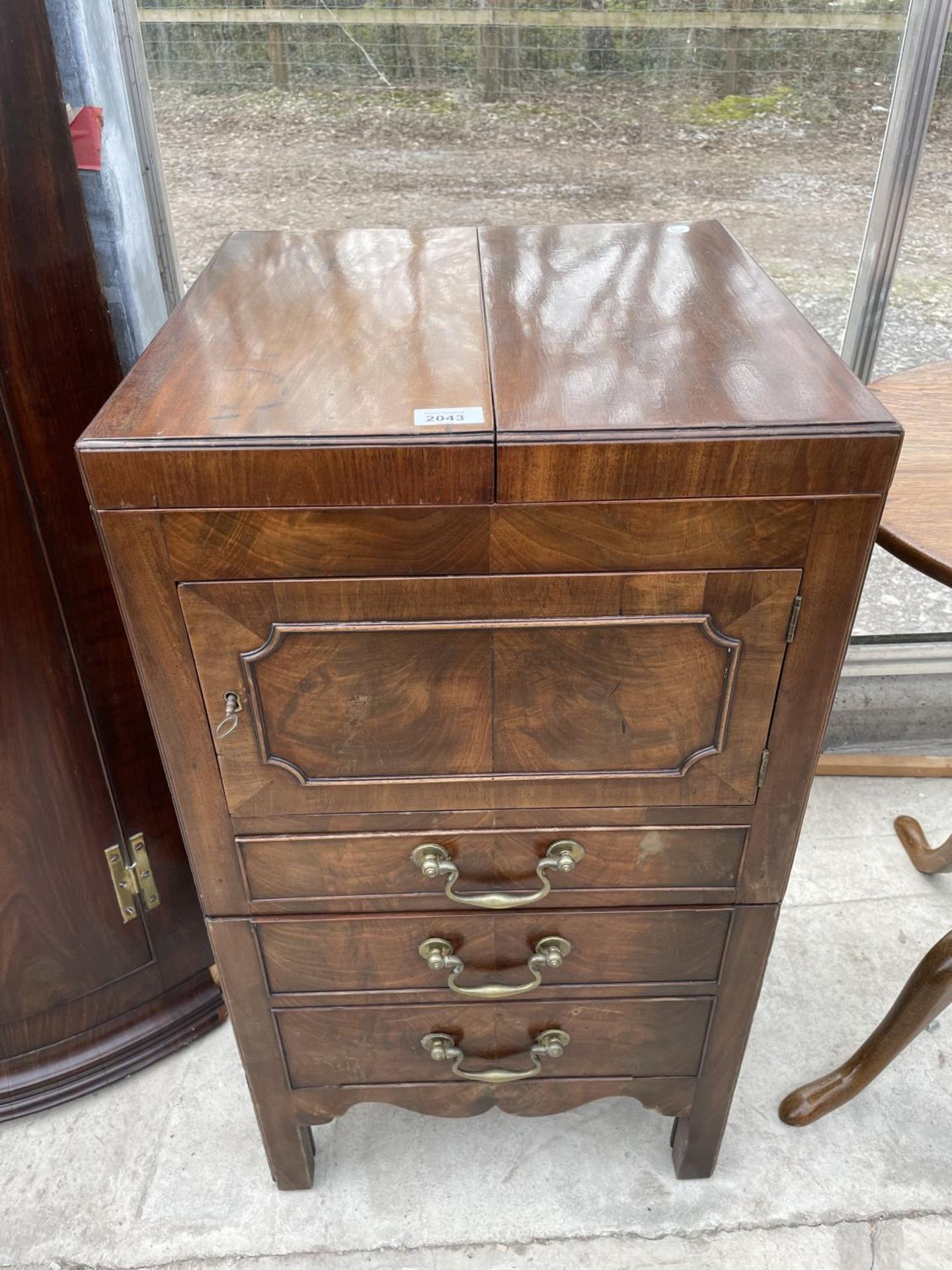 A GEORGIAN MAHOGANY COMMODE CHEST/ WASHSTAND WITH FOLD-OVER TOP+ PULL OUT BASE [LACKING CHAMBER POT]