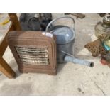 A VINTAGE HEATER AND A 2 GALLON WATERING CAN