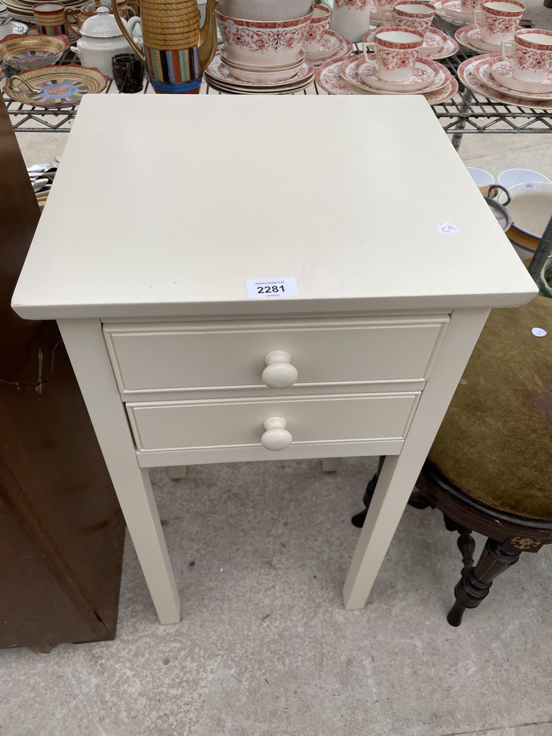 A MODERN TWO DRAWER BEDSIDE CHEST