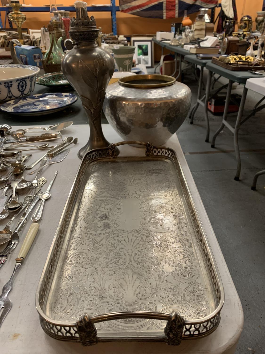 A SILVER PLATED RECTANGULAR SERVING TRAY, A PEWTER OIL LAMP WITH EMBOSSED LEAF DECORATION BY JEAN