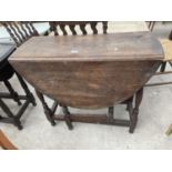 AN EARLY 20TH CENTURY OAK GATELEG DINING TABLE