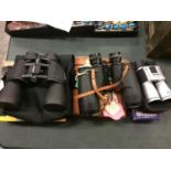 THREE PAIRS OF VARIOUS BINOCULARS WITH CARRYING CASES