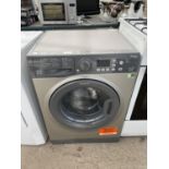 A GRAPHITE HOTPOINT 7KG A++ WASHING MACHINE, PAT TEST, FUNCTION TEST AND SANITIZED BUT NO WARRANTY