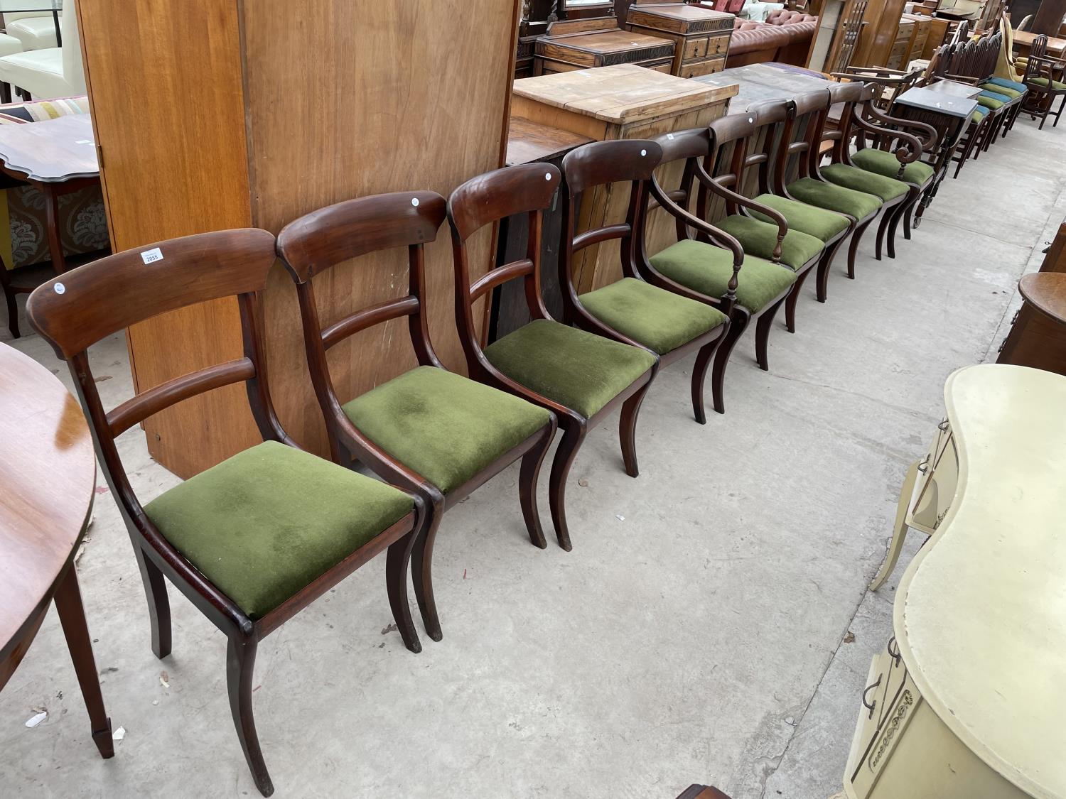 A SET OF FOUR 19TH CENTURY MAHOGANY DINING CHAIRS ON SABRE LEGS