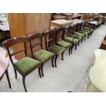 A SET OF FOUR 19TH CENTURY MAHOGANY DINING CHAIRS ON SABRE LEGS