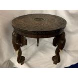 A HEAVILY CARVED ANGLO-INDIAN ROSEWOOD TRIPOD TABLE SUPPORTED ON ELEPHANT HEAD AND TRUNK LEGS H: