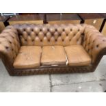 A MODERN BROWN THREE SEATER CHESTERFIELD SETTEE