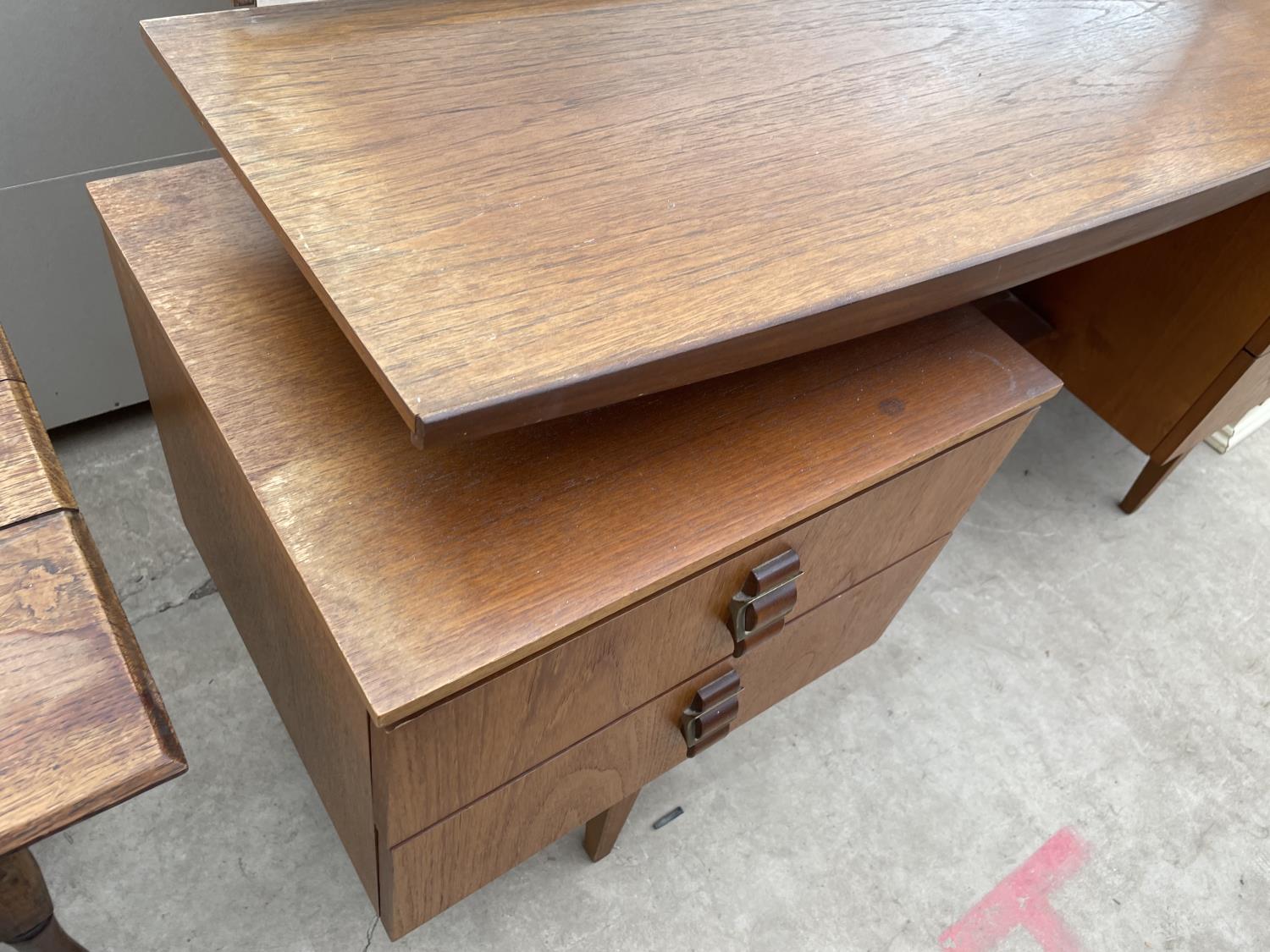 A RETRO TEAK DRESSING TABLE ENCLOSING FOUR DRAWERS WITH BELT BUCKLE STYLE HANDLES, 60" WIDE - Image 3 of 5
