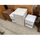 A TEAK BEDSIDE CABINET, TWO WHITE BEDSIDE CABINETS AND A WHITE BEDSIDE CHEST OF THREE DRAWERS