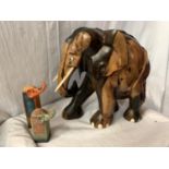 A LARGE CARVED HEAVY HARD WOOD ELEPHANT (H: APPROX. 30CM) AND TWO CERAMIC ELEPHANT ITEMS