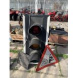 A TRAFFIC LIGHT RIG IN WORKING ORDER BUT NO WARRANTY AND A ROAD SIGN