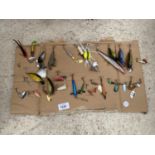 AN ASSORTMENT OF FISHING LURES AND HOOKS