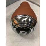 A BENTLEY LEATHER AND CHROME GEAR KNOB WITH PUSH BUTTON