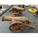 A PAIR OF BRASS AND CAST IRON CANNONS 35CM X 13.5CM