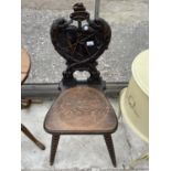 A LATE VICTORIAN OAK HALL CHAIR WITH MARITIME CARVED BACK FEATURING ANCHOR AND FISH, ON BOBBIN