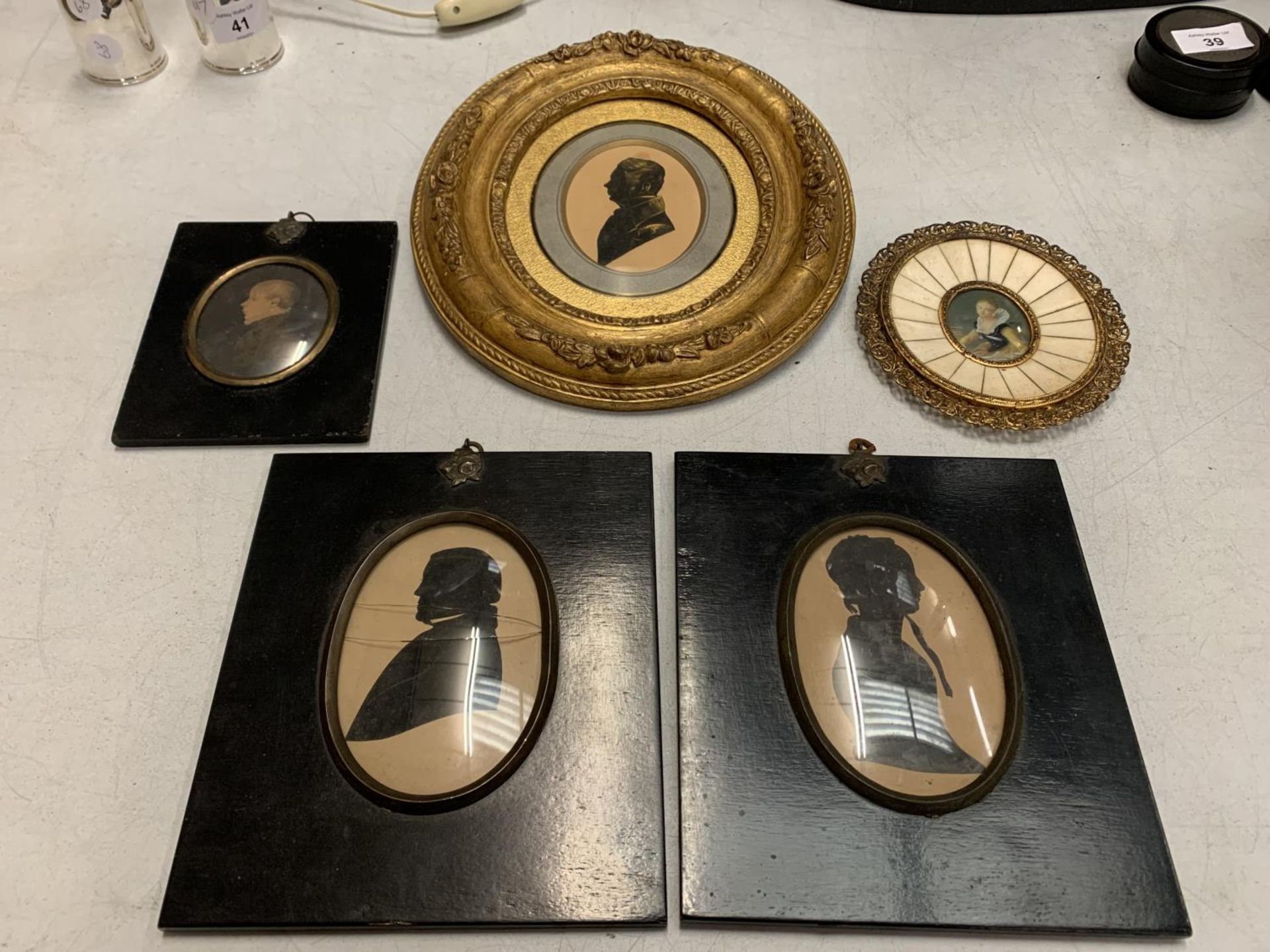 FOUR SMALL VINTAGE PICTURES IN THE SILLOUETTE STYLE AND A MINIATURE GILT FRAMED OIL