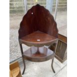 A GEORGIAN MAHOGANY CORNER WASHSTAND WITH UNDERSHELF ENCLOSING DRAWER AND LATER MOVEABLE SHELF