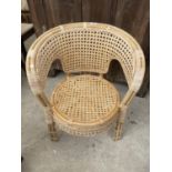 A MODERN BAMBOO AND WICKER ELBOW CHAIR