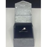 A 9 CARAT WHITE GOLD SOLITAIRE RING