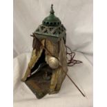 A BERGMAN STYLE COLD PAINTED BRONZE LAMP DEPICTING AN AFRICAN TRIBESMAN IN A TENT - HEIGHT