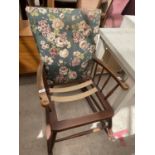 A PARKER KNOLL STYLE ROCKING CHAIR