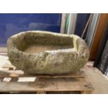 A LARGE STONE TROUGH PLANTER