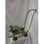 A VINTAGE FOLD AWAY DOLL'S PUSH CHAIR