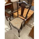 AN EDWARDIAN MAHOGANY ELBOW CHAIR ON FRONT CABRIOLE LEGS