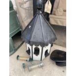 A BLACK AND WHITE WOODEN DOVE COTE