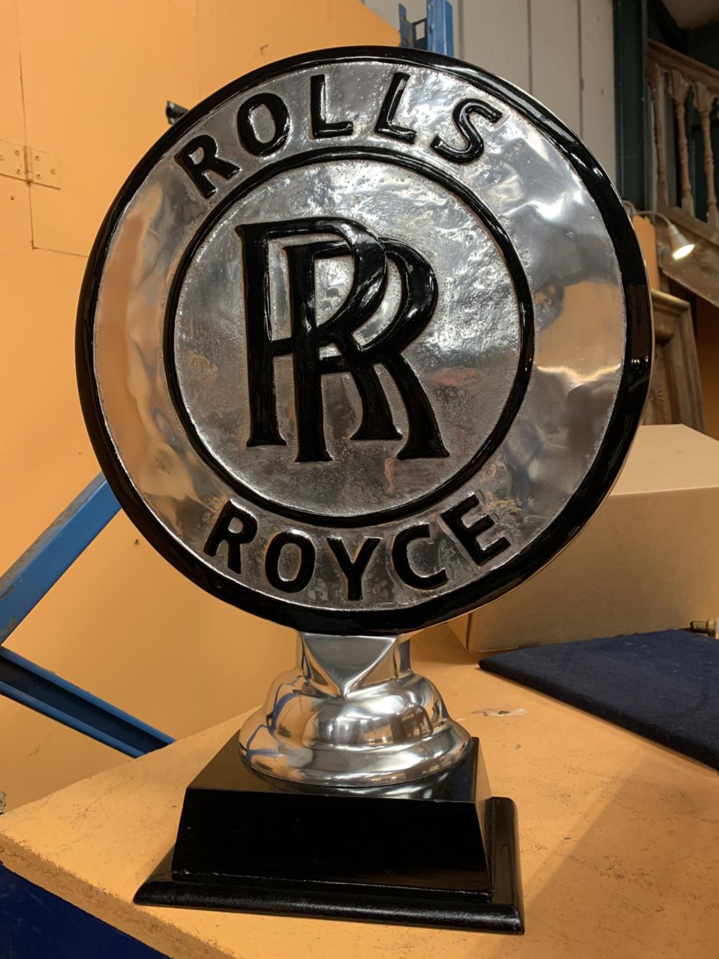 A CHROME ROLLS ROYCE SIGN ON A WOODEN BASE H: 50CM