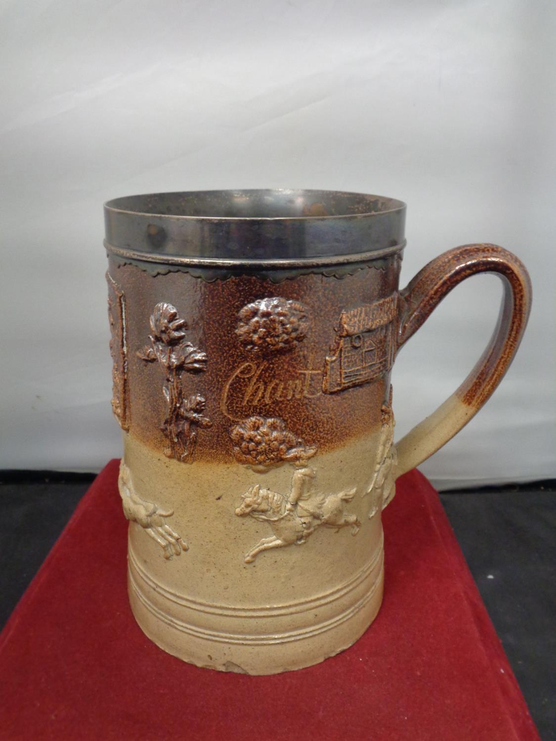 A VERY LARGE LAMBETH WARE TANKARD INSCRIBED MILLFORD 1735 WITH A WHITE METAL PROBABLY SILVER RIM