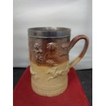 A VERY LARGE LAMBETH WARE TANKARD INSCRIBED MILLFORD 1735 WITH A WHITE METAL PROBABLY SILVER RIM