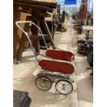 A VINTAGE CHILDRENS PUSH CHAIR