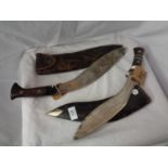 TWO LARGE SHEATHED KUKRI KNIVES