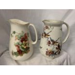 TWO LARGE CERAMIC JUGS ONE WITH FLORAL DECORATION, THE OTHER PEARL POTTERY WITH AVIAN DESIGN H: 31CM