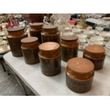 A COLLECTION OF EIGHT HORNSEA STORAGE JARS WITH LIDS