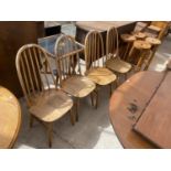 FOUR 'CENTA' ELM AND BEECH WINDSOR STYLE DINING CHAIRS