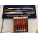 A VINTAGE BOXED MEAT CARVING SET AND SIX BOXED COMMUNITY PLATE CAKE FORKS