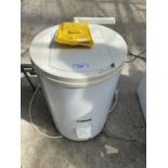 A WHITE ZANUSSI SPIN DRYER WITH INSTRUCTION MANUAL BELIEVED IN WORKING ORDER BUT NO WARRANTY