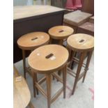 A SET OF FOUR MODERN TALL BEECH STOOLS, EACH WITH TWO BAR STRETCHERS