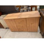 A PINE EFFECT CABINET WITH TWO DOORS AND THREE DRAWERS