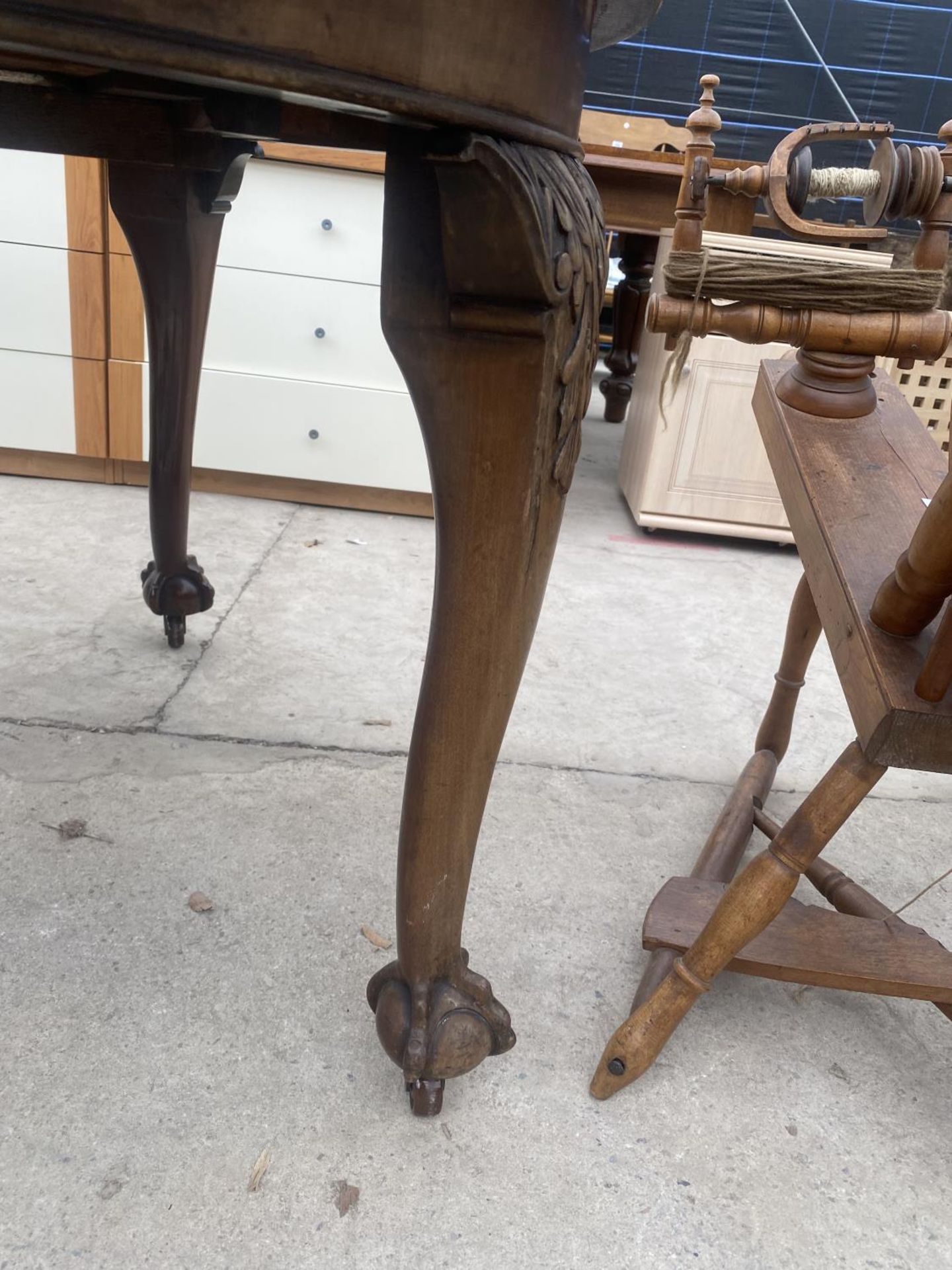 A VICTORIAN WIND OUT DINING TABLE 47 INCHES DIAMETER ON CABRIOLE LEGS WITH BALL AND CLAW FEET (TWO - Image 2 of 3